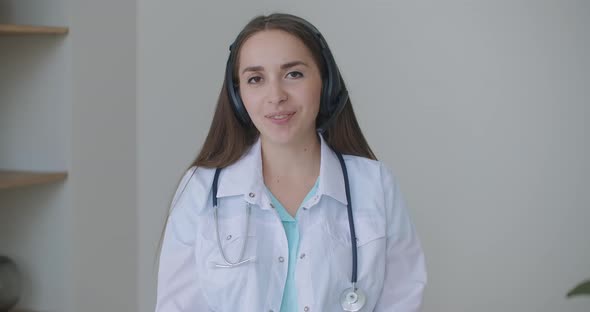 Smiling Young Female Doctor Wear White Uniform Stethoscope Consulting Online Patient Via Video Call