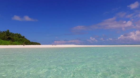 Sunny nature of shore beach by blue ocean and sand background in sunlight