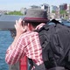Young Man Tourist Looking Through Big Street Binoculars Telescope at Beautiful Touristic Places - VideoHive Item for Sale