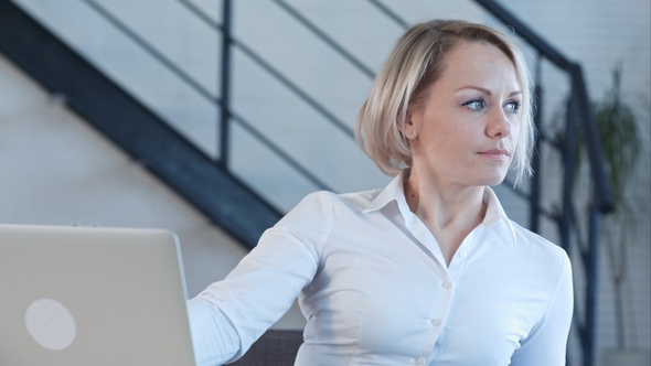 Smiling business woman finishing her work