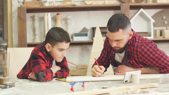 In Carpentry Studio Children and Youngsters Can Learn a Useful Profession Together with Dad.