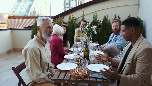 Family and friends having dinner together