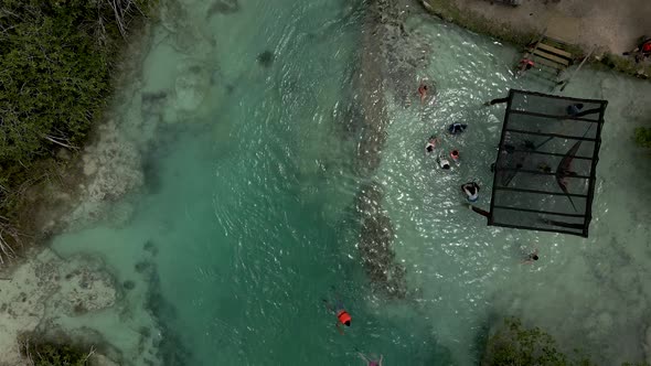 Cenital view of swimmers in lagoon