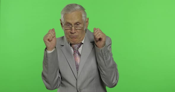 Elderly Businessman in Suit Something Emotionally Tells. Chroma Key Background