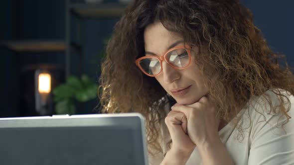 Portrait of a Middleaged Woman Working at a Laptop