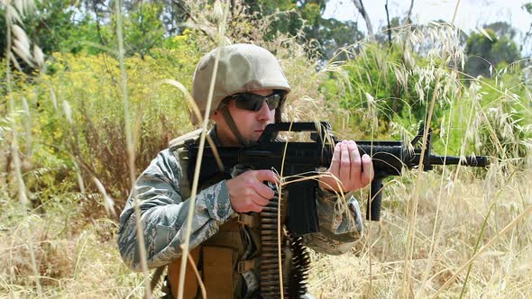 Military soldier guarding with a rifle