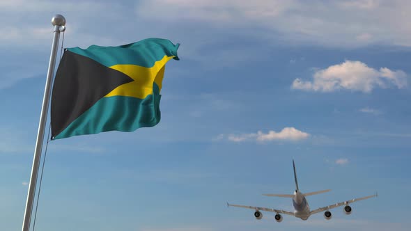 Airplane Flying Over Flag of Bahamas