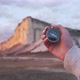Woman Hand with a Compass in Front of White Rock Crimea - VideoHive Item for Sale
