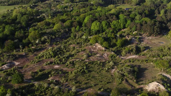 An onward aerial drone shot over the dunes located near the Oostvoorne town in the Dutch province of