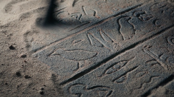 Brush Cleans Sand From Ancient Egyptian Tomb Carving