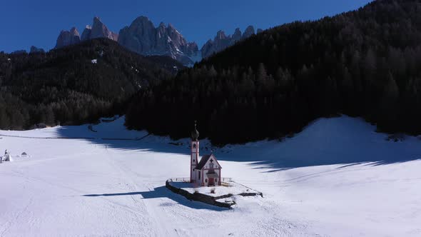 Church of St John and Dolomites in Winter