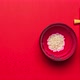 Rice Bowl and Chopsticks on Red Background. Stop Motion - VideoHive Item for Sale