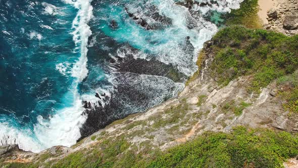 Top View Aerial Of Coastline Cliffs and Ocean Waves