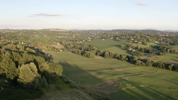 A modern European village in the foothills located on the slopes of the hills