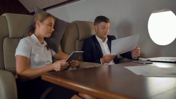 Business People Have Private Business Discussion Inside of Luxury Jet