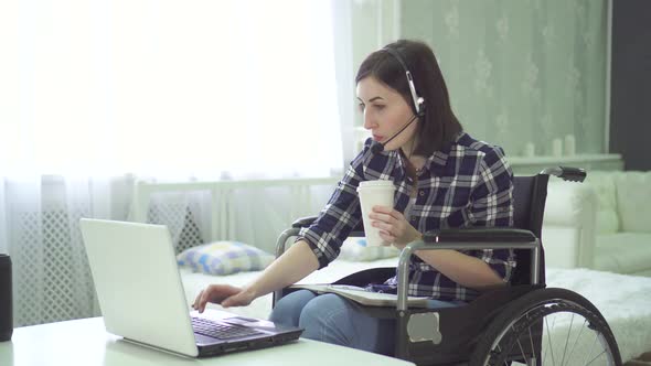 Portrait Young Woman Disabled Wheelchair Remote Work at Home Computer Headset