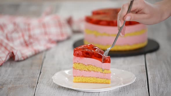 Eat Piece of Cake with a Vanilla Biscuit, Raspberry Mousse and Jelly, Sweet Pastries.