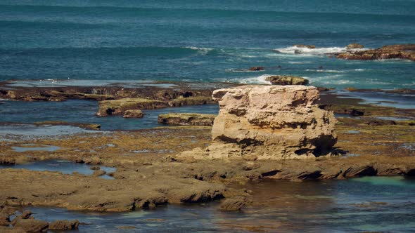 Iconic stack sand stone rock formations along the back beach of Sorrento, Australia. PAN RIGHT