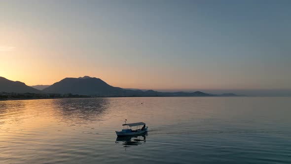 Sunrise Fishing boat goeas to sea aerial view Turkey Alanya 4 K