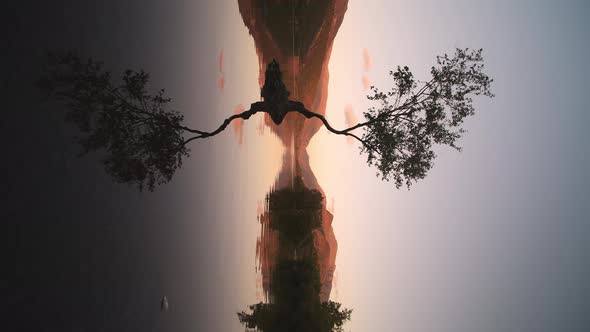 Vertical Shot Of Nature Reflections On The Calm Water Of Llyn Padarn Lake In Snowdonia, Gwynedd On A