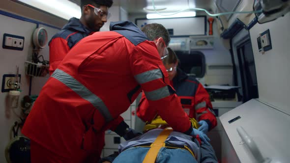 Paramedics Resuscitating Man in Car