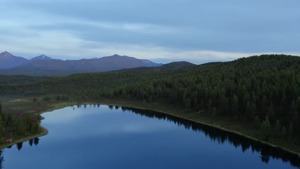 Valley of lakes with mountains and dramatic sky in Altai in evening time