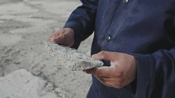 Unrecognizable Person Holding Piece of Granite