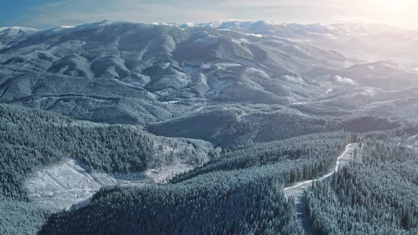 Aerial Sunrise Over Snow Mountain Ranges