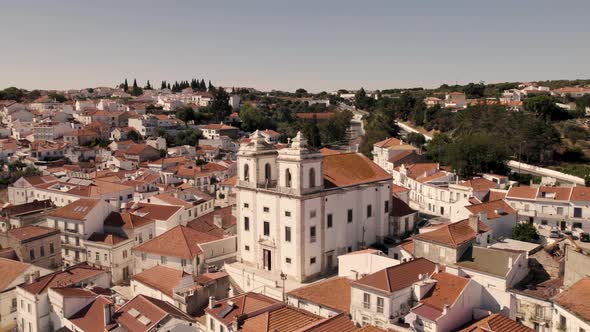 Santiago Church and Alcaçer do Sal white houses cityscape, Alentejo. Aerial view