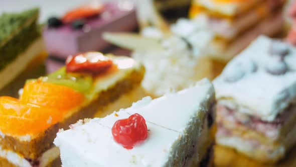 Pieces of Different Cakes on a Retrostyle Baking Tray