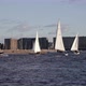 Yacht Sailboats Sailing Against the Background of the City and Residential Buildings - VideoHive Item for Sale