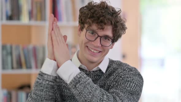 Portrait of Positive Young Man Clapping Applaud