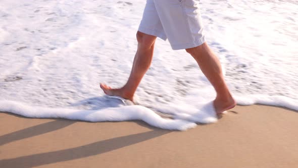 Mature Man Exercising At The Beach