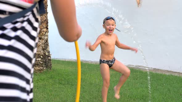 Water fun in the yard on hot summer day