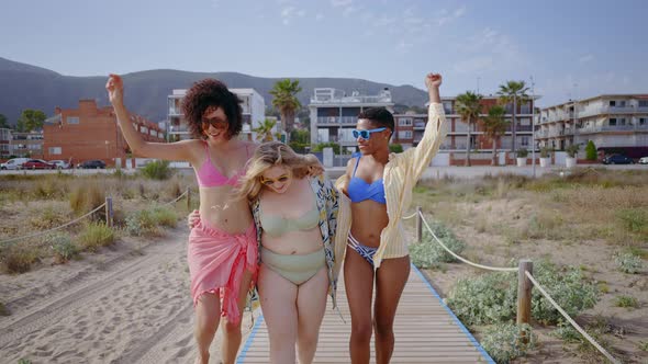 young women having fun on the beach