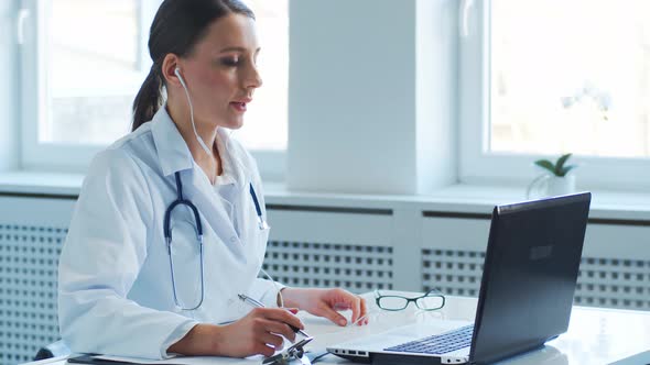 Professional medical doctors working in hospital office making research.