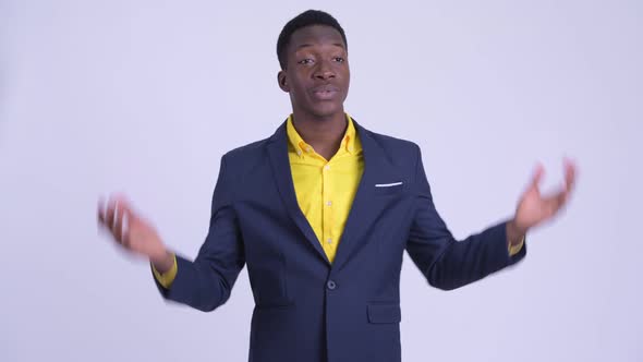 Young Happy African Businessman in Suit Explaining Something