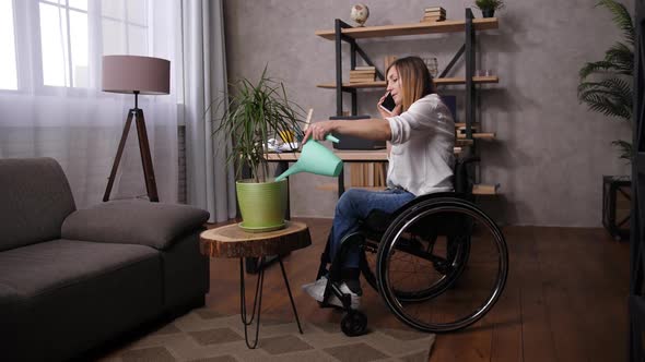 Disabled Woman Watering Plant and Talking on Phone