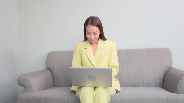 Young asian woman use laptop