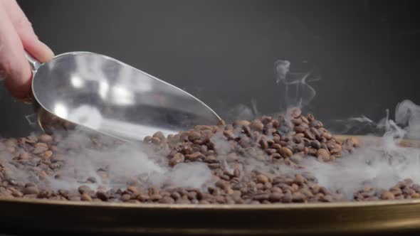 Metal Scoop Mixing Roasting Coffee Beans Close Up