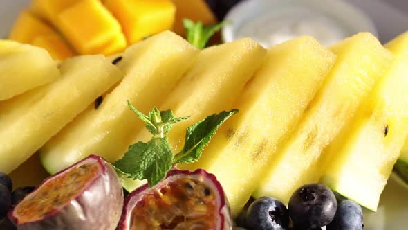 Fresh Tropical Fruit Charcuterie Dessert Grazing Platter on White Plate