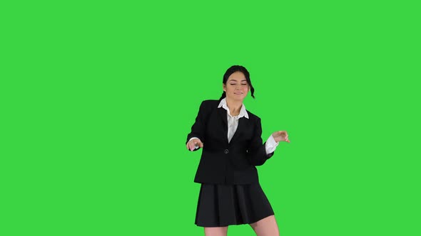 Dancing Brunette Businesswoman Walking In, Stops in the Middle and Then Goes Away on a Green Screen