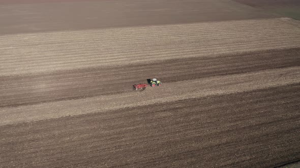 Moving tractor with plow