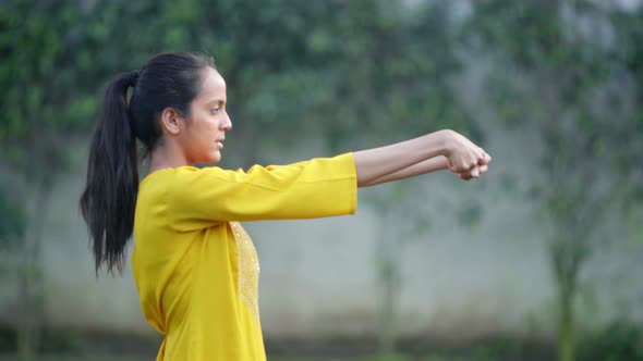 Indian woman doing stretching and exercise