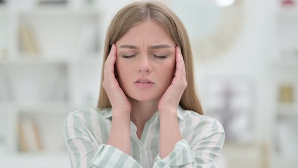 Portrait of Exhausted Young Woman Having Headache