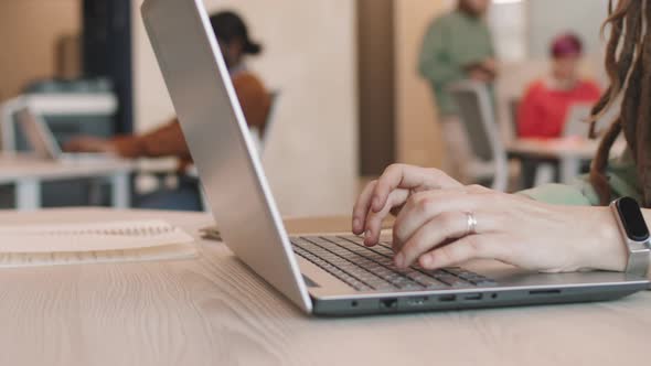 Unrecognizable Businesswoman Working on Laptop