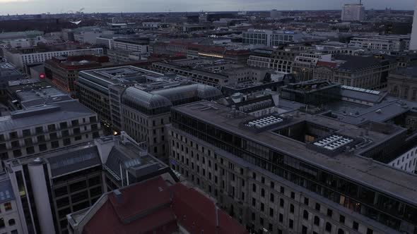 AERIAL: Slowly Passing the Center of Berlin Germany with Office Buildings and Shopping Streets at