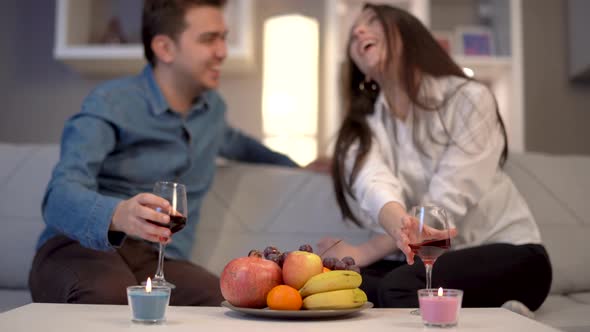 Couple drinking wine chatting.