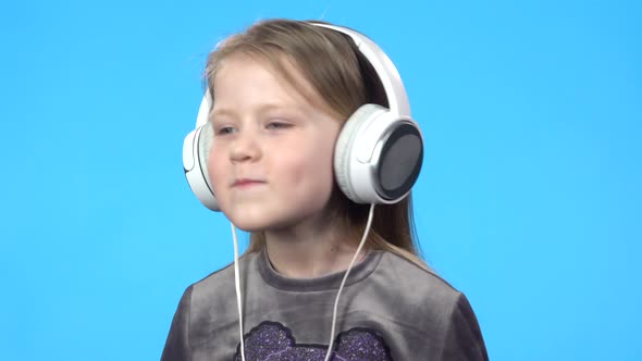 Little Girl Smiling, Listening To the Music, Nodding Her Head