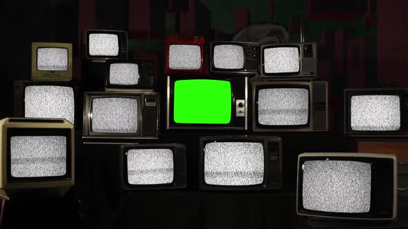 Pile of Retro TVs with Static Noise and Green Screen. Zoom In.
